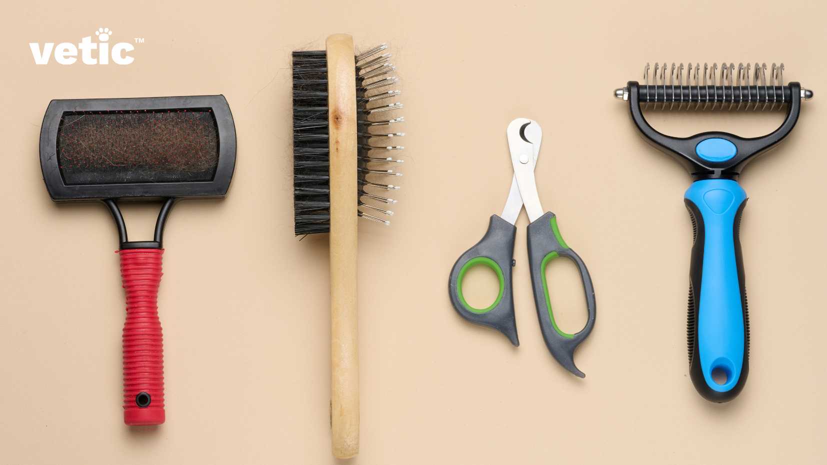 This is an image of everything you will need to groom your short-haired cat at home. from left to right - there's a black slicker brush with a red handle, a double sided wooden brush, a small-sized nail clipper with a safety lock and a blue handled matt remover brush. the image has a text that says “vetic™”.